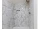 Shower with large marble tiles, built-in shelf, and modern fixtures at 3218 Seven Springs Rd, Hillsborough, NC 27278
