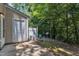 Backyard featuring neutral siding, fenced area, AC unit, patio, and exterior door at 3352 Tarleton W, Durham, NC 27713