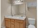 Bathroom featuring a double sink vanity and large mirror, with neutral wall colors at 3352 Tarleton W, Durham, NC 27713