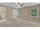 Spacious bedroom with ceiling fan, ensuite bathroom, and two windows at 3352 Tarleton W, Durham, NC 27713