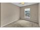 Bedroom showcasing a neutral wall color, carpeted flooring, a ceiling fan and a window at 3352 Tarleton W, Durham, NC 27713