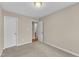 Bedroom featuring a neutral wall color, carpeted flooring, with open doors to a bathroom at 3352 Tarleton W, Durham, NC 27713