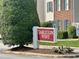 Tarleton West community sign featuring a manicured lawn and colorful flowers at 3352 Tarleton W, Durham, NC 27713