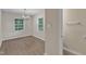 Dining area with modern chandelier, natural light, and luxury vinyl flooring at 3352 Tarleton W, Durham, NC 27713