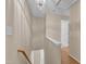 Hallway with staircase leading up and down, lit by overhead light fixture at 3352 Tarleton W, Durham, NC 27713