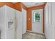 Bright kitchen featuring a refrigerator with water dispenser and exterior door for access at 3352 Tarleton W, Durham, NC 27713