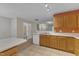 Open kitchen featuring updated appliances, tile flooring, and a cozy breakfast bar at 3352 Tarleton W, Durham, NC 27713