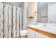 Bathroom featuring a toilet, sink, mirror and a shower with neutral design elements at 346 Summerwalk Cir, Chapel Hill, NC 27517