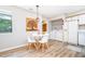 Charming dining area with modern table and chairs, adjacent to the laundry area and kitchen at 346 Summerwalk Cir, Chapel Hill, NC 27517