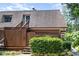 Charming exterior view of a two-story home with a wood fence and stairs leading to the front entrance at 346 Summerwalk Cir, Chapel Hill, NC 27517