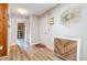 Inviting foyer with wood floors, a decorative mirror, and a view into other rooms at 346 Summerwalk Cir, Chapel Hill, NC 27517