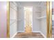 Walk-in closet with wire shelving and hanging rods, providing ample storage space at 346 Summerwalk Cir, Chapel Hill, NC 27517