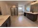 Open bathroom design with separate vanities, tiled floors, soaking tub, and glass shower at 3509 Bailey Lake Dr, Fuquay Varina, NC 27526