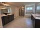 Spacious bathroom showcasing tiled floors, separate vanities and a tiled tub and shower at 3509 Bailey Lake Dr, Fuquay Varina, NC 27526