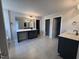 Large bathroom showcasing tile floors, separate vanities, and an oversized mirror with lighting at 3509 Bailey Lake Dr, Fuquay Varina, NC 27526