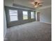 Bright bedroom featuring plush carpeting and multiple windows to maximize natural light at 3509 Bailey Lake Dr, Fuquay Varina, NC 27526