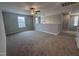 Spacious loft area with neutral carpet, large windows, and ample space for a home office or entertainment zone at 3509 Bailey Lake Dr, Fuquay Varina, NC 27526