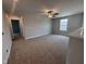 Spacious loft area featuring plush carpeting and a ceiling fan for added comfort at 3509 Bailey Lake Dr, Fuquay Varina, NC 27526