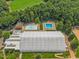 Aerial view featuring tennis courts and swimming pools in this amenity-rich community at 404 Troy Pl, Raleigh, NC 27609