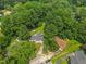 Aerial view of a charming property surrounded by lush greenery at 404 Troy Pl, Raleigh, NC 27609