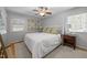 Bright bedroom with hardwood floors, neutral walls, and ample natural light at 404 Troy Pl, Raleigh, NC 27609