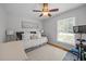 Relaxing bedroom with daybed, large window, and neutral decor at 404 Troy Pl, Raleigh, NC 27609