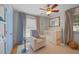 Bright Bedroom boasts a white crib, comfortable chair, and blue accents at 404 Troy Pl, Raleigh, NC 27609