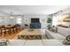 Bright living room featuring hardwood floors, stylish furnishings, and an adjacent dining area at 404 Troy Pl, Raleigh, NC 27609