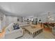Open-concept living area with hardwood floors, neutral tones, and seamless flow to the kitchen at 404 Troy Pl, Raleigh, NC 27609