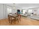 Spacious living and dining area with hardwood floors and ample natural light at 404 Troy Pl, Raleigh, NC 27609