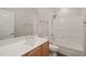 Clean bathroom features tile floors, updated fixtures and a tub with shower at 501 Finsbury St # 204, Durham, NC 27703