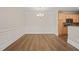 Bright dining space with hardwood floors and elegant chandelier at 501 Finsbury St # 204, Durham, NC 27703