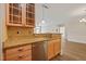 Kitchen featuring granite countertops, stainless appliances, and glass-front cabinets at 501 Finsbury St # 204, Durham, NC 27703