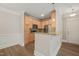 Kitchen with stainless appliances, light wood cabinets, and granite countertops at 501 Finsbury St # 204, Durham, NC 27703