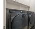New front load Samsung washer and dryer with built-in shelving for additional storage at 501 Finsbury St # 204, Durham, NC 27703