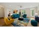 Bright living room with hardwood floors, large windows, and colorful decor at 501 Finsbury St # 204, Durham, NC 27703