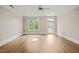 Spacious and bright living room with large windows and outdoor access at 501 Finsbury St # 204, Durham, NC 27703