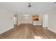 Open-concept living area with hardwood floors and access to the kitchen at 501 Finsbury St # 204, Durham, NC 27703