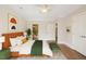 Well-lit main bedroom featuring a walk-in closet and ensuite bathroom at 501 Finsbury St # 204, Durham, NC 27703