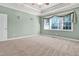Bright bedroom with a large window, neutral decor creating a relaxing retreat at 5107 Granbury Dr, Durham, NC 27713