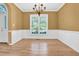 Bright dining space showcasing hardwood floors, natural light, and modern fixtures at 5107 Granbury Dr, Durham, NC 27713