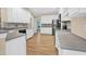 Spacious kitchen boasts white cabinets, modern appliances, and ample countertop space at 5107 Granbury Dr, Durham, NC 27713