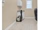 Functional laundry room with storage cabinets, utility sink, and tile flooring at 5107 Granbury Dr, Durham, NC 27713