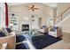 Bright living room with high ceilings, fireplace, and built-in shelving, creating a cozy and inviting atmosphere at 5107 Granbury Dr, Durham, NC 27713