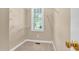 Bright walk-in closet with a window, providing natural light and ventilation at 5107 Granbury Dr, Durham, NC 27713