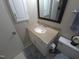 This bathroom features a single sink, tan countertops, and white cabinetry for storage at 5805 Mapleridge Rd, Raleigh, NC 27609
