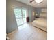 Bedroom with a balcony access, neutral walls and stylish white furniture at 5805 Mapleridge Rd, Raleigh, NC 27609