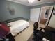 This bedroom includes a large closet for storage and a cozy bed at 5805 Mapleridge Rd, Raleigh, NC 27609