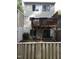 This exterior features a wooden deck and a home with beige siding at 5805 Mapleridge Rd, Raleigh, NC 27609