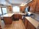A bright kitchen showcases ample countertop space, stainless steel appliances, and natural light from the windows at 5805 Mapleridge Rd, Raleigh, NC 27609